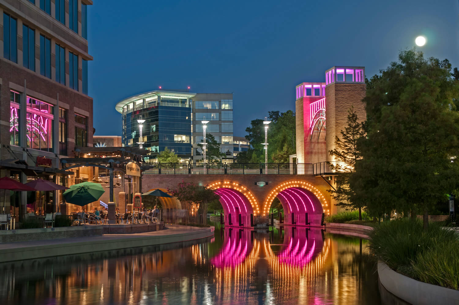 Waterways Illuminated with Pink Neon at The Woodlands